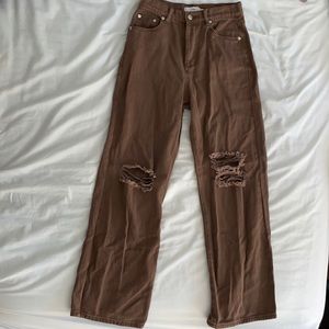 brown adika jeans with knee rips